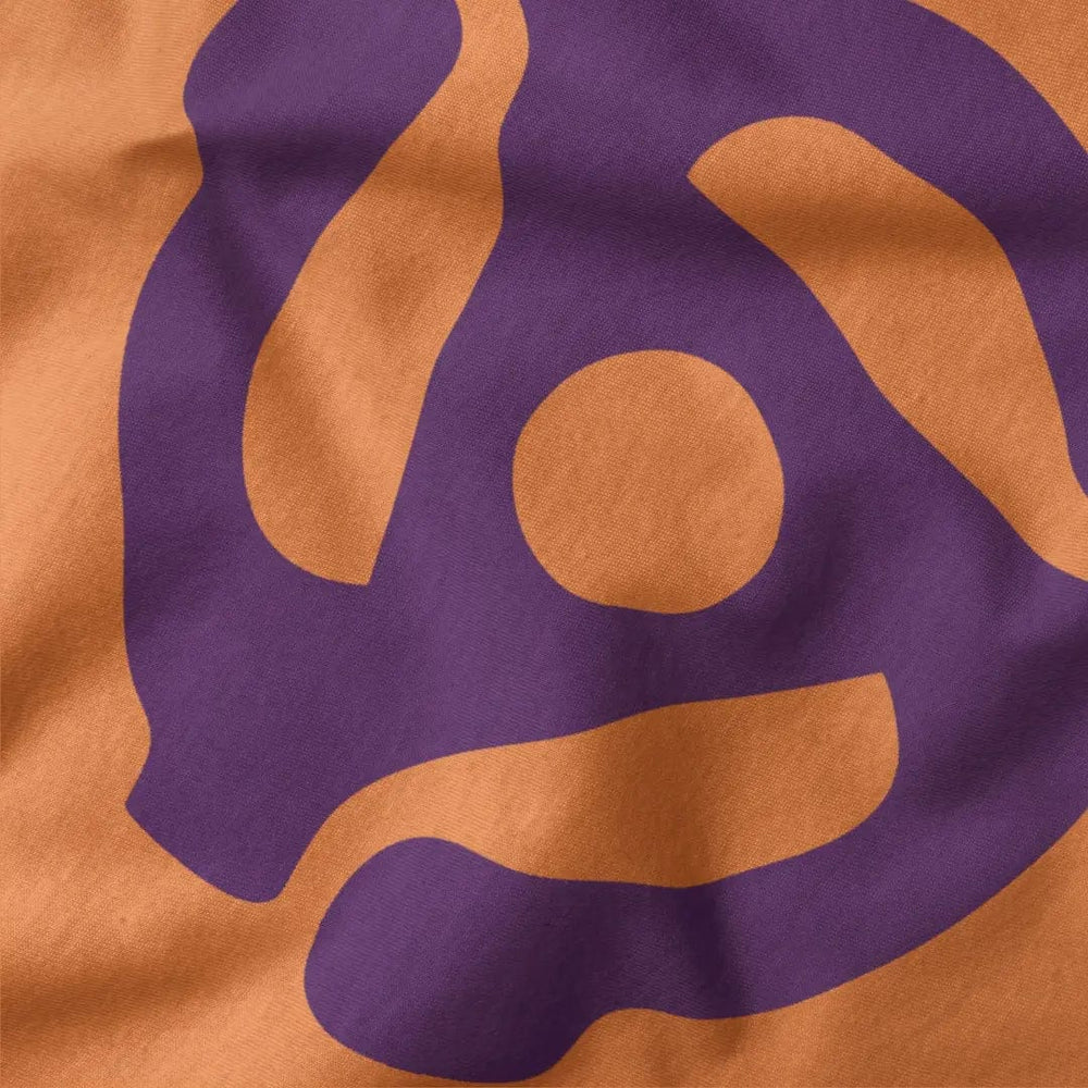 45rpm adapter classic tee in burnt orange, close-up of the print