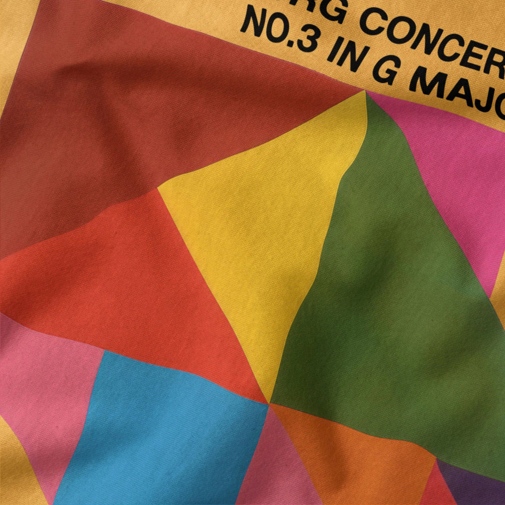 bach: brandenburg concerto no. 3 classic tee in mustard, close-up of the print