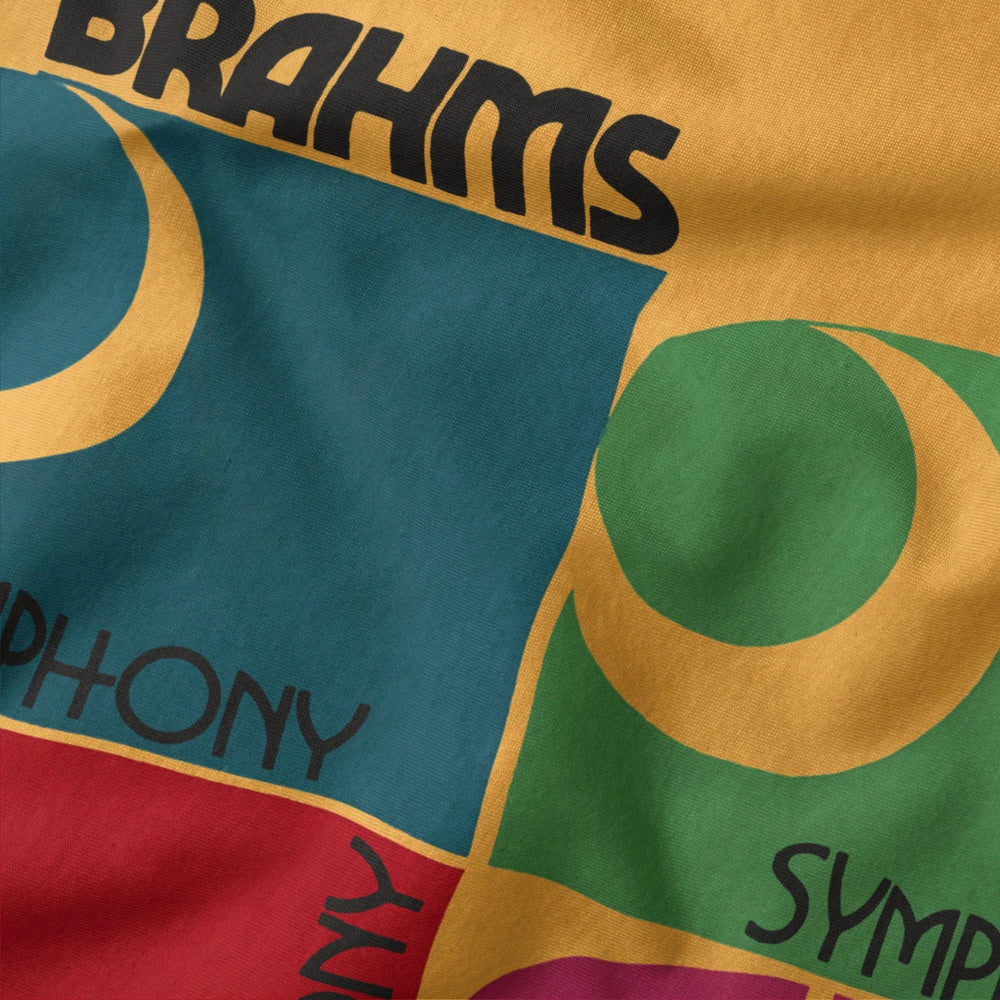 brahms: four symphonies classic tee in mustard, close-up of the print