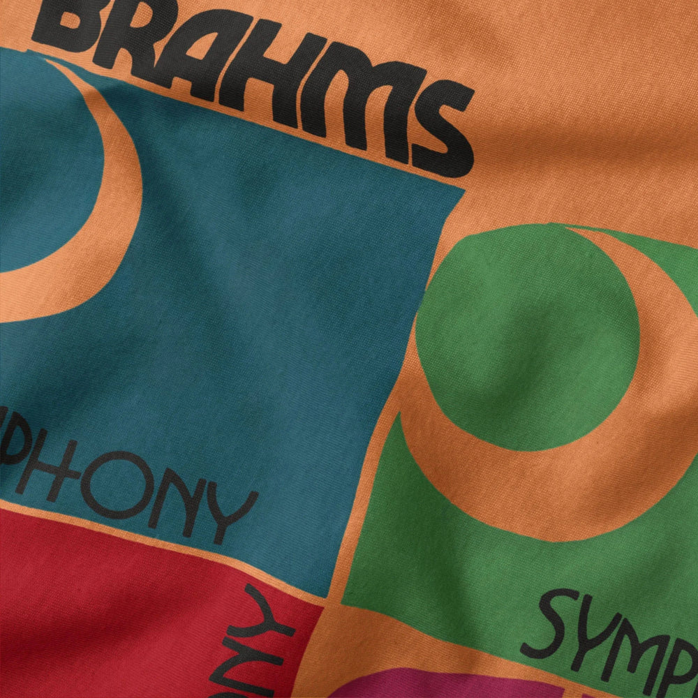 brahms: four symphonies classic tee in burnt orange, close-up of the print