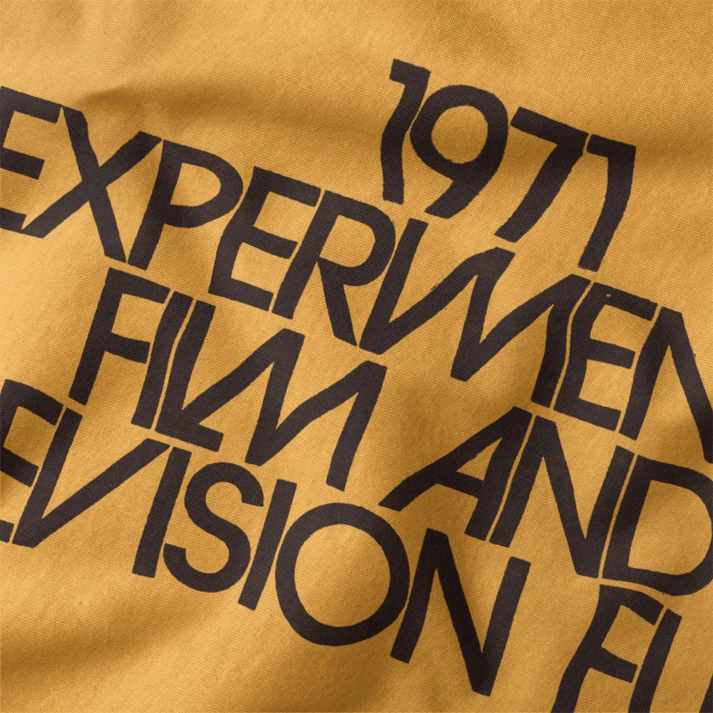 experimental film & television fund classic tee in mustard, close-up of the print