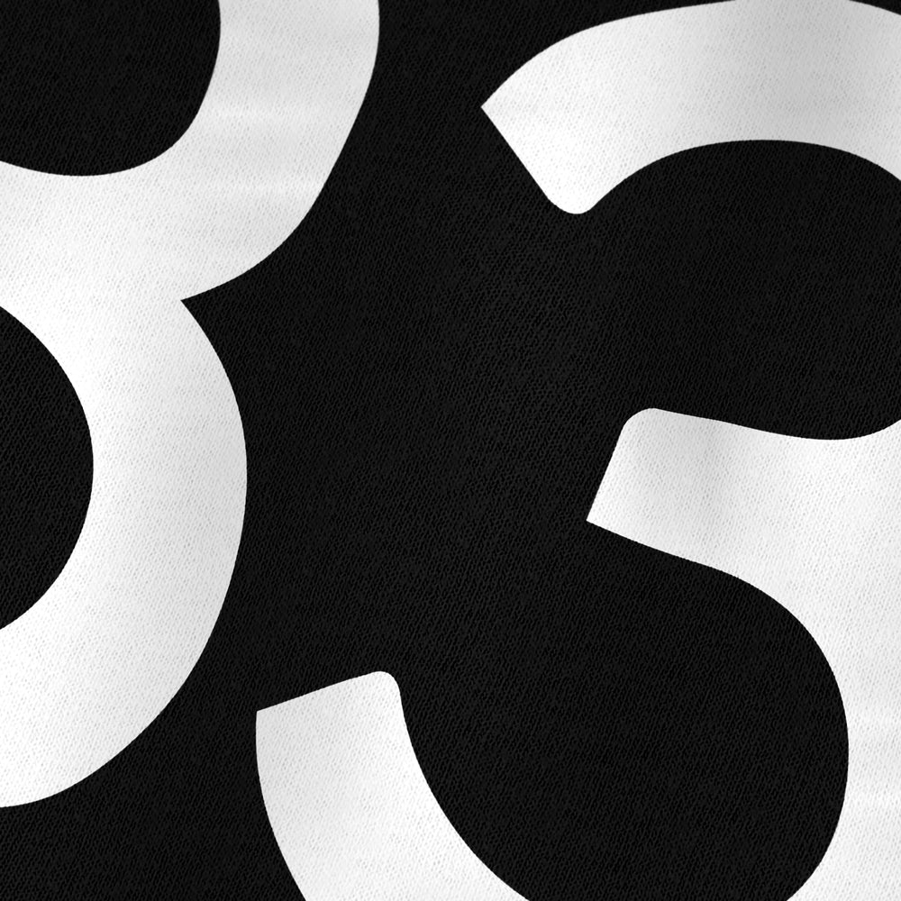 john cage: 4'33" kids classic tee in black, close-up of the print