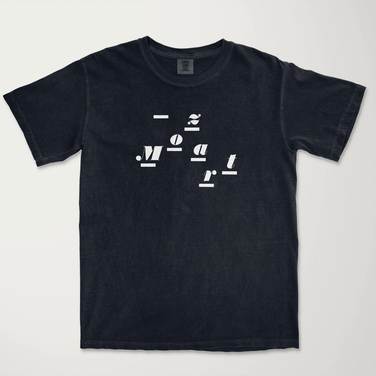 mozart: wordmark vintage heavyweight tee in black, laid flat