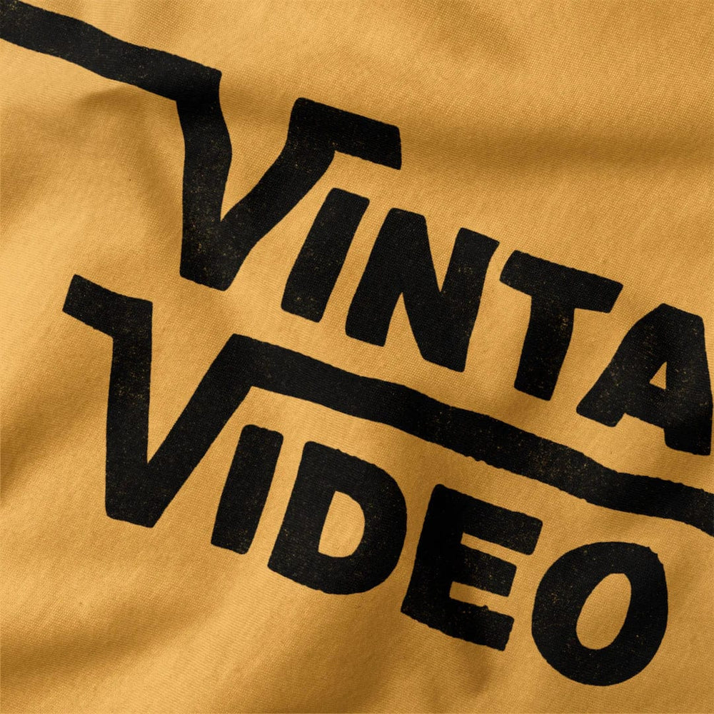 vintage video classic tee in mustard, close-up of the print
